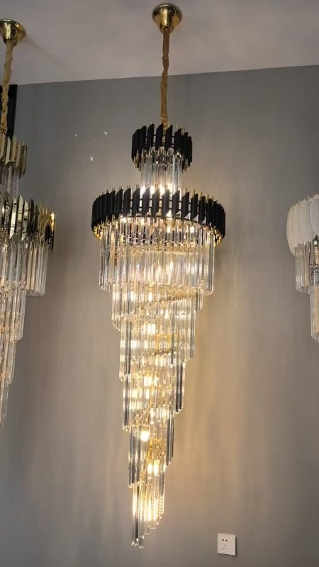 Chandelier hanging against a gray wall

